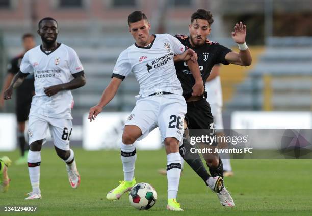 Emanuele Pecorino of Juventus competes for the ball with Alessandro Macchioni of Pro Vercelli during the Serie C match between Juventus U23 and Pro...