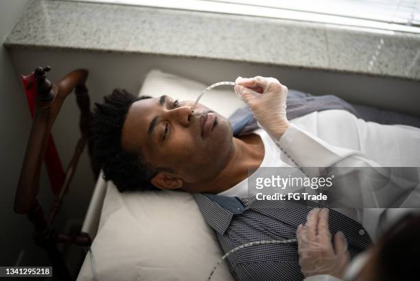 man doing an exam at the hospital - endoscope stock pictures, royalty-free photos & images