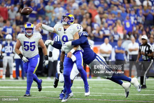 Defensive tackle DeForest Buckner of the Indianapolis Colts tackles quarterback Matthew Stafford of the Los Angeles Rams in the first half of the...