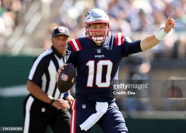 Quarterback Mac Jones of the New England Patriots directs the offense on the move against the New York Jets in the first half of the game at MetLife...
