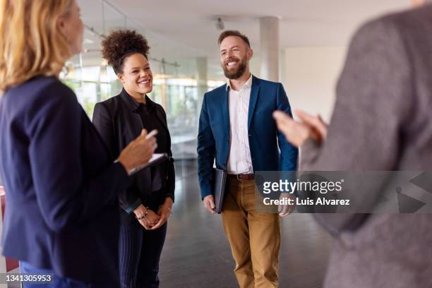 businesswoman being appreciated by her team in office - employee recognition stock pictures, royalty-free photos & images