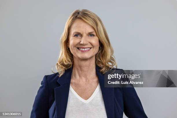 portrait of a successful senior businesswoman - white jacket stock pictures, royalty-free photos & images