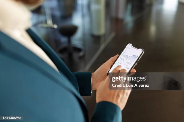 businessman's hands using smart phone - navy blue interior stock pictures, royalty-free photos & images