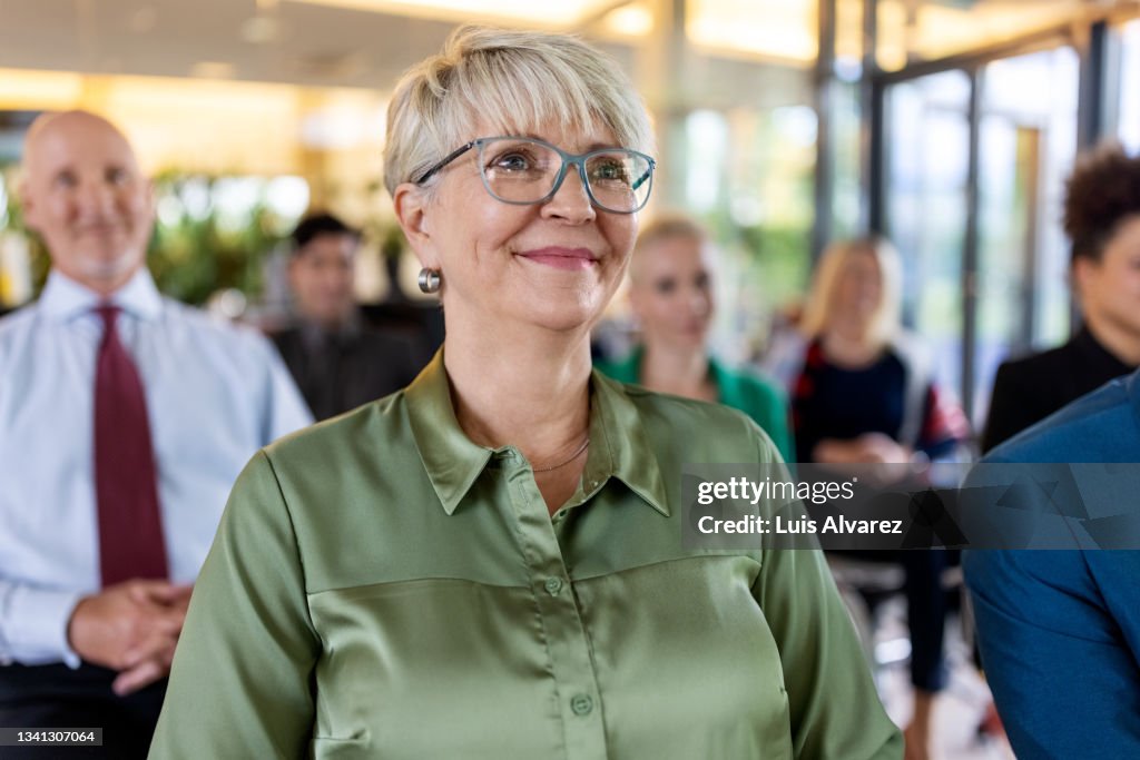 Senior woman attending a business conference