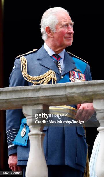 Prince Charles, Prince of Wales watches a Spitfire and Hurricane fly-past from the balcony of Church House after attending the Battle of Britain 81st...