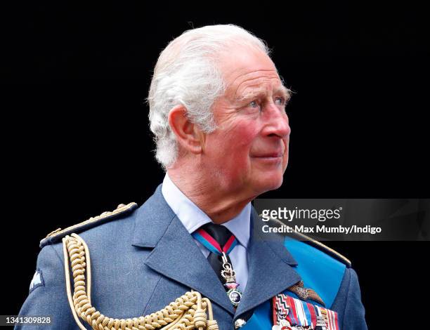 Prince Charles, Prince of Wales watches a Spitfire and Hurricane fly-past from the balcony of Church House after attending the Battle of Britain 81st...