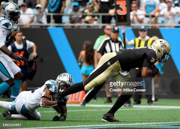 Quarterback Jameis Winston of the New Orleans Saints runs for a touchdown during the third quarter in the game against the Carolina Panthers at Bank...