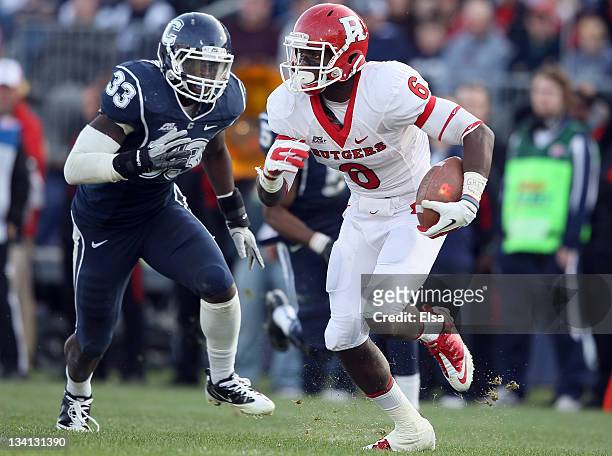 Mohamed Sanu of the Rutgers Scarlet Knights carries the ball as Yawin Smallwood of the Connecticut Huskies defends on November 26, 2011 at Rentschler...