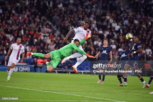 Gianluigi Donnarumma of Paris Saint-Germain fights for possession during the Ligue 1 Uber Eats match between Paris Saint Germain and Lyon at Parc des...