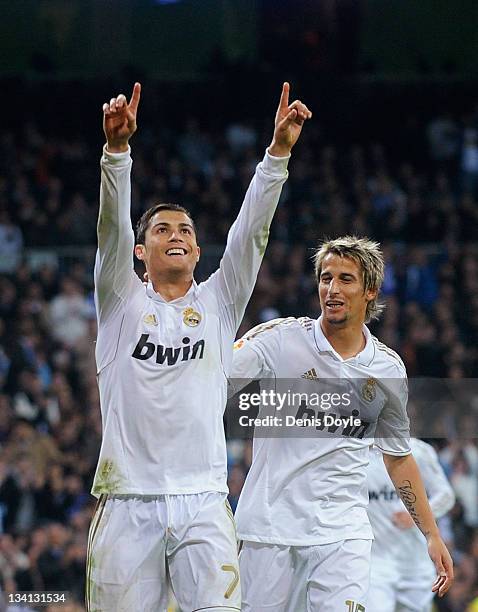 Cristiano Ronaldo of Real Madrid celebrates with Fabio Coentrao after scoring Real's 4th goal during the La Liga match between Real Madrid and...