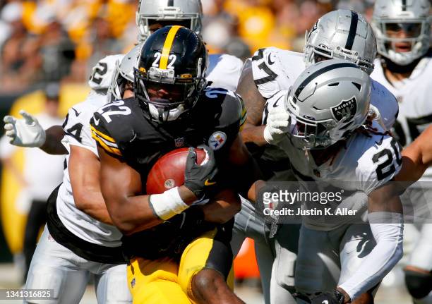 Running back Najee Harris of the Pittsburgh Steelers runs with the ball against cornerback Damon Arnette of the Las Vegas Raiders in the fourth...