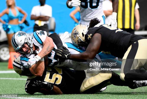 Running back Christian McCaffrey of the Carolina Panthers scores a touchdown during the second half in the game against the New Orleans Saints at...