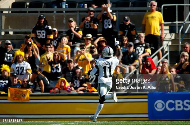 Wide receiver Henry Ruggs III of the Las Vegas Raiders runs after a catch for a touchdown in the fourth quarter of the game against the Pittsburgh...