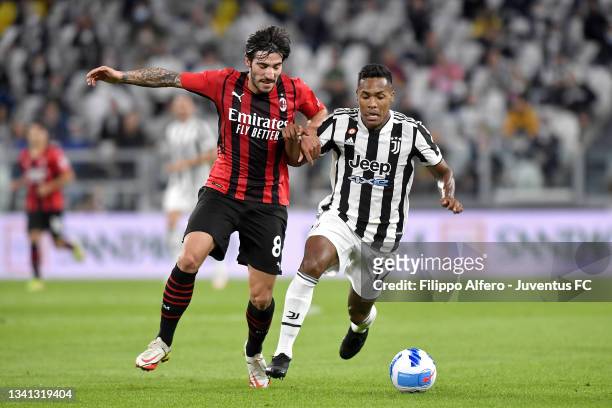 Alex Sandro of Juventus fights for the ball with Sandro Tonali of AC Milan during the Serie A match between Juventus and AC Milan at Allianz stadium...