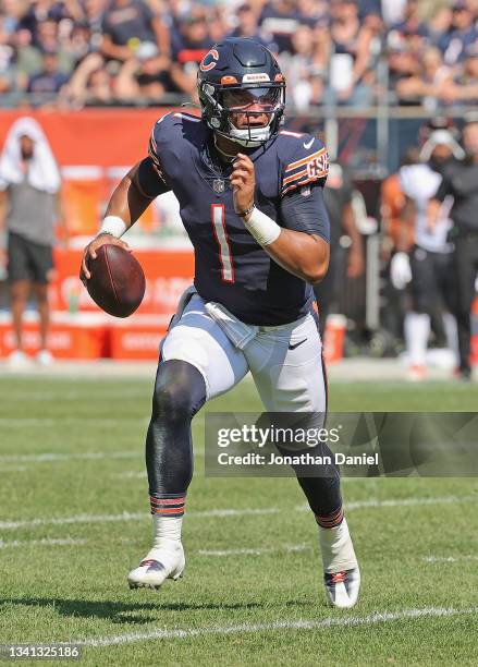 Justin Fields of the Chicago Bears runs for a first down against the Cincinnati Bengals at Soldier Field on September 19, 2021 in Chicago, Illinois....