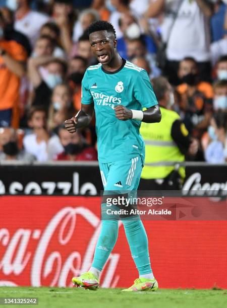 Vinicius Junior of Real Madrid celebrates after scoring their side's first goal during the La Liga Santander match between Valencia CF and Real...
