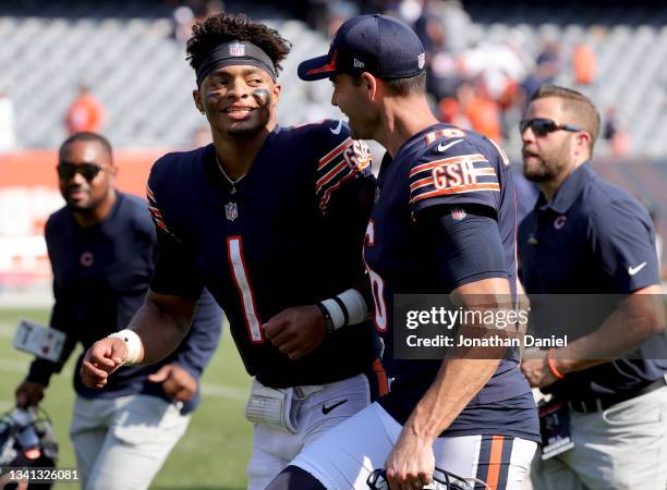 Quarterback Justin Fields and punter Pat O'Donnell of the Chicago Bears celebrate after the 20-17 win over the Cincinnati Bengals at Soldier Field on...