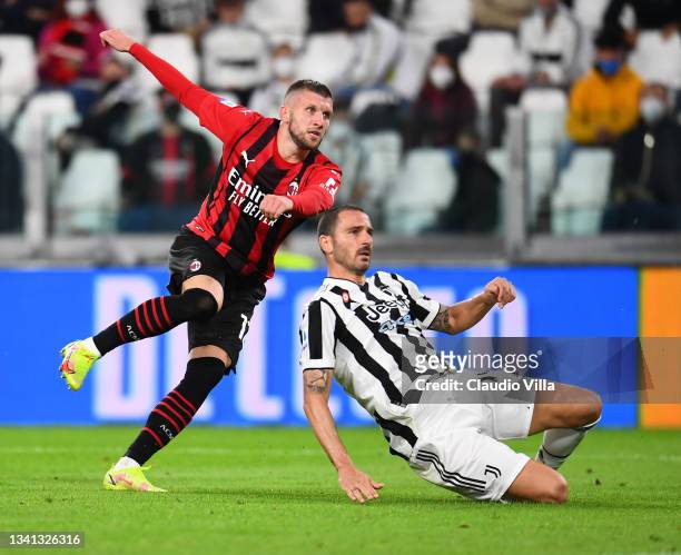 Ante Rebic of AC Milan competes for the ball with Leonardo Bonucci of Juventus during the Serie A match between Juventus and AC Milan at on September...