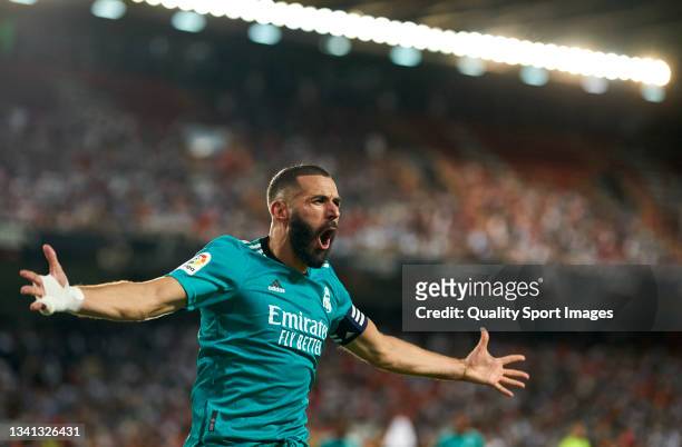 Karim Benzema of Real Madrid celebrates after scoring his team's second goal during the La Liga Santander match between Valencia CF and Real Madrid...