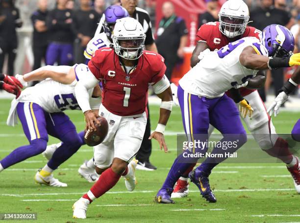 Quarterback Kyler Murray of the Arizona Cardinals runs with the ball against the Minnesota Vikings in the first quarter of the game at State Farm...
