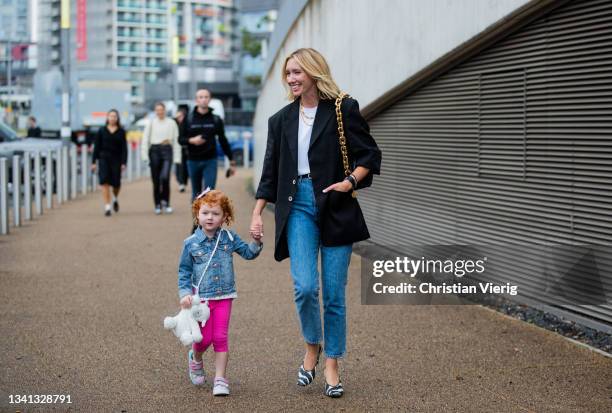 Lisa Aiken with child seen outside Rejina Pyo during London Fashion Week September 2021 on September 19, 2021 in London, England.