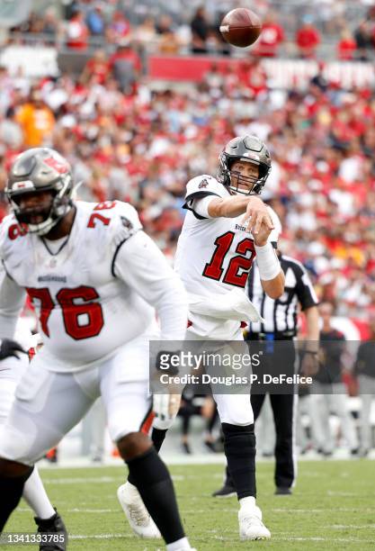 Quarterback Tom Brady of the Tampa Bay Buccaneers throws a touchdown pass to Mike Evans in the second quarter of the game against the Atlanta Falcons...