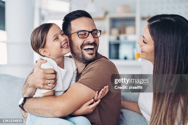 affectionate father holding his little daughter - family wearing glasses stock pictures, royalty-free photos & images