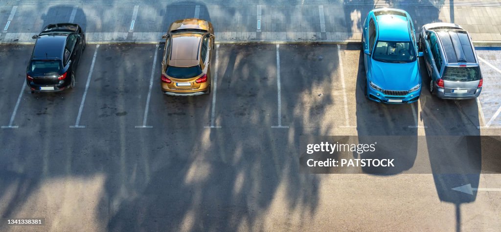 Aerial view of four parked passenger cars.