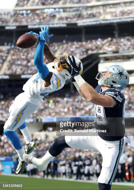 Defensive back Nasir Adderley of the Los Angeles Chargers breaks up a pass intended for tight end Blake Jarwin of the Dallas Cowboys during the...