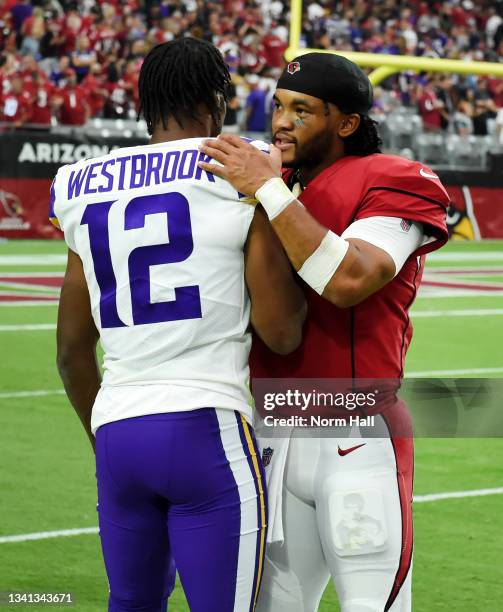 Quarterback Kyler Murray of the Arizona Cardinals and Dede Westbrook of the Minnesota Vikings talk after the game at State Farm Stadium on September...