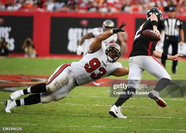 Ndamukong Suh of the Tampa Bay Buccaneers attempts to tackle quarterback Matt Ryan of the Atlanta Falcons in the fourth quarter of the game at...