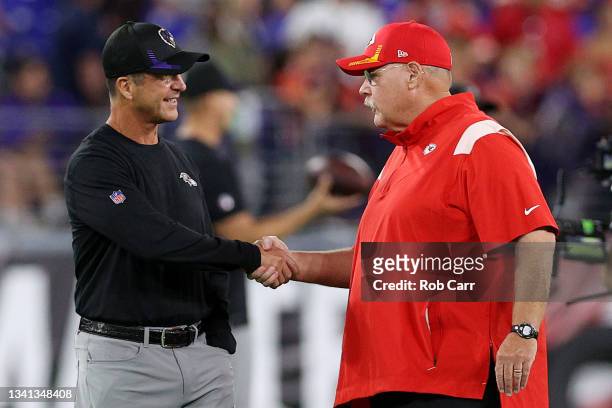 Head coach John Harbaugh of the Baltimore Ravens greets head coach Andy Reid of the Kansas City Chiefs prior to the game at M&T Bank Stadium on...