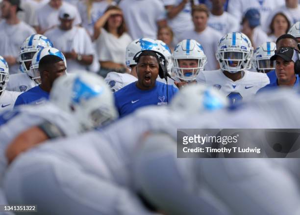 Maurice Linguist head coach of the Buffalo Bulls calls a play from the sideline against the Coastal Carolina Chanticleers at UB Stadium on September...