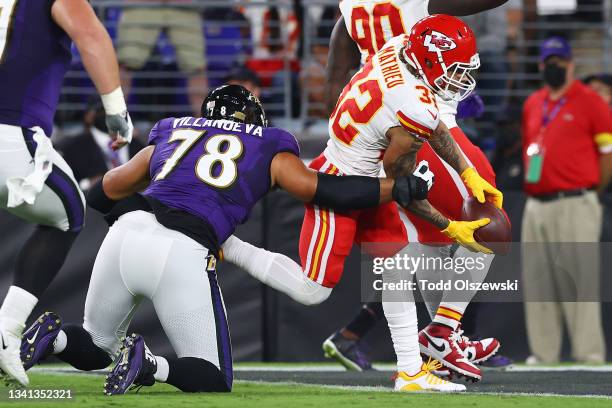 Tyrann Mathieu of the Kansas City Chiefs dives into the endzone for a touchdown after a 34-yard interception return against the Baltimore Ravens...