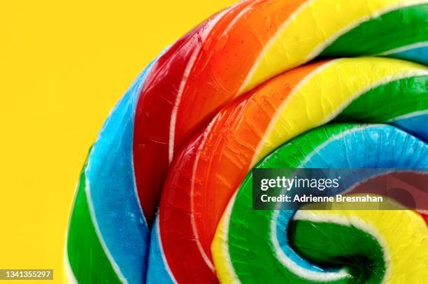 rainbow swirl lollipop - old fashioned candy stock pictures, royalty-free photos & images