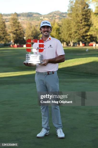 Max Homa celebrates with the champion's trophy after winning the Fortinet Championship at Silverado Resort and Spa on September 19, 2021 in Napa,...