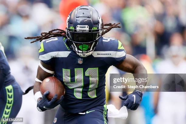 Alex Collins of the Seattle Seahawks carries the ball against the Tennessee Titans during the second quarter at Lumen Field on September 19, 2021 in...