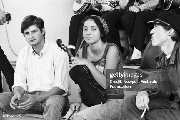 Members of the old-timey folk, blues, and jazz ensemble, The Jim Kweskin Jug Band, pose for a portrait backstage in July, 1964 at the Newport Folk...