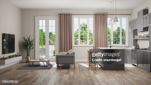 side view of open plan kitchen with living room and garden view from the window - living room stock pictures, royalty-free photos & images