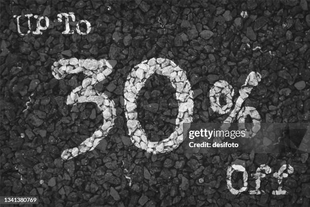 black and white coloured pebbles making a rustic poster with text up to 30 % off painted on gravel road pattern, for clearance up to thirty percent sale related vector backgrounds - white pebbles stock illustrations