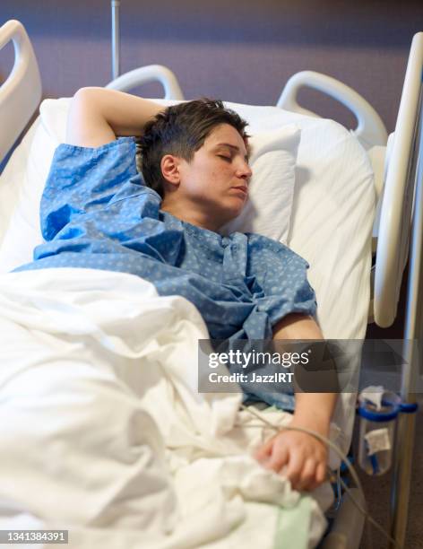 woman lying in a hospital bed, ecg print - post operation stock pictures, royalty-free photos & images