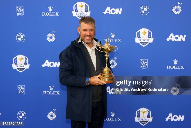 Lee Westwood of Team Europe poses with the Ryder Cup Trophy before departing Heathrow Airport ahead of the 43rd Ryder Cup on September 20, 2021 in...