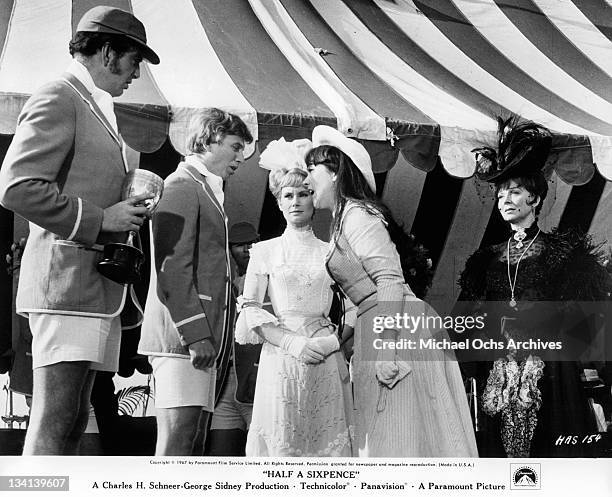 Tommy Steele and Julia Foster argue as Penelope Horner watches in a scene from the film 'Half A Sixpence', 1967.