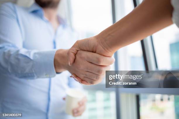 successful teamwork on strategy sealed with handshake - aperto de mãos imagens e fotografias de stock