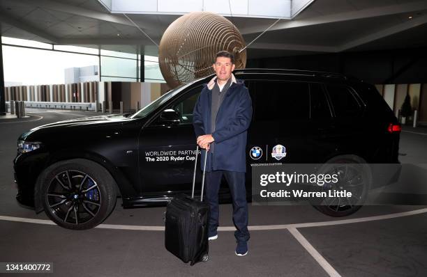 Team Europe captain Padraig Harrington poses as he arrives at the terminal before departing Heathrow Airport ahead of the 43rd Ryder Cup on September...