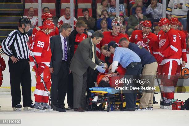 Patrick Eaves of the Detroit Red Wings is taken off the ice by stretcher after taking a slap shot to the right ear during an NHL game against the...