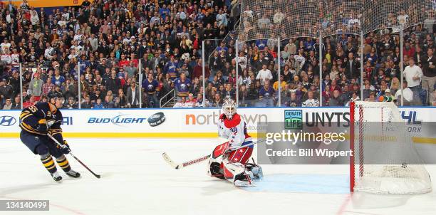 Jochen Hecht of the Buffalo Sabres scores a third period goal against Tomas Vokoun of the Washington Capitals at First Niagara Center on November 26,...