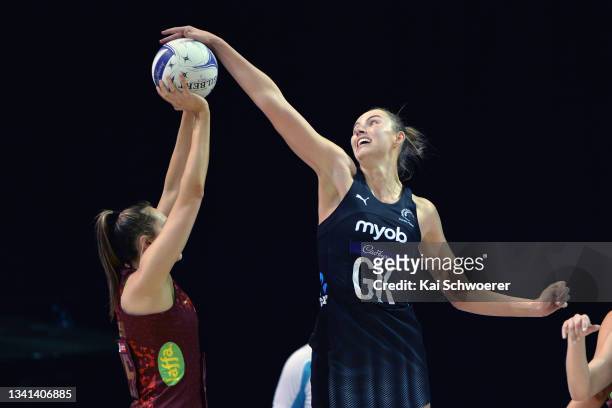 Kelly Jury of New Zealand challenges George Fisher of England during game one of the Cadbury Netball Series between the New Zealand Silver Ferns and...