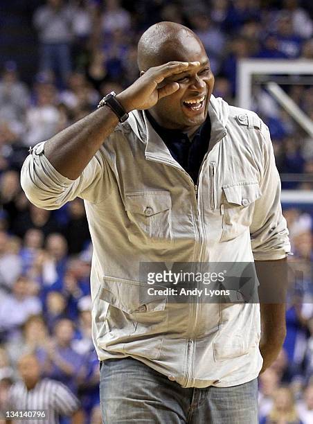 Antoine Walker a former star for the Kentucky Wildcats waves to the crowd during the game against the Portland Pilots at Rupp Arena on November 26,...