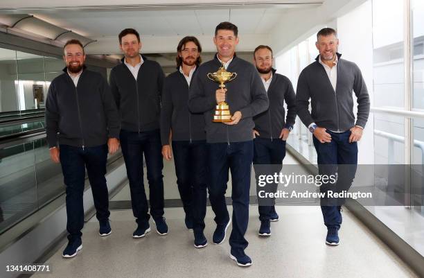 Shane Lowry, Bernd Wiesberger, Tommy Fleetwood, Captain Padraig Harrington, Tyrrell Hatton and Lee Westwood of Team Europe walk to the gate with the...